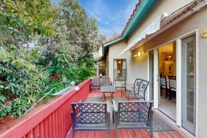 a deck with chairs and tables on a house at Southwestern Sun Sanctuary in Sedona