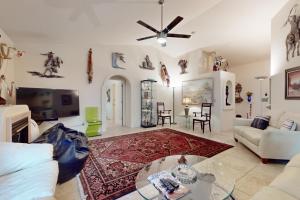 a living room with a couch and a table at Southwestern Sun Sanctuary in Sedona