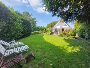Κήπος έξω από το Ferienhaus Holland