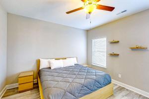 a bedroom with a bed and a ceiling fan at Old Bryan Salento - A in Myrtle Beach