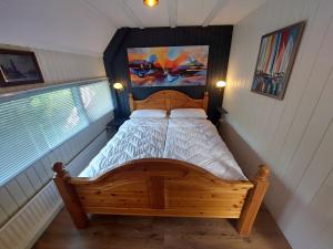 Ένα ή περισσότερα κρεβάτια σε δωμάτιο στο Ferienhaus Holland +20 φωτογραφίες