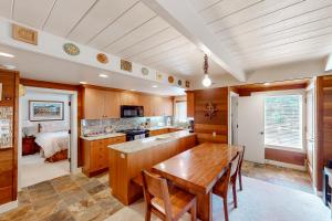 a kitchen with a wooden table in a room at Sun Valley Escape in Sun Valley