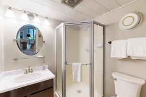 a bathroom with a shower and a sink at Creekside Escape in Sun Valley +34 photos