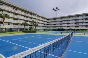 a tennis court in front of a large apartment building at Hilton Head Resort 3308 in Hilton Head Island