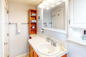 a bathroom with a sink and a mirror at Yarmouth Bliss in Yarmouth +14 photos