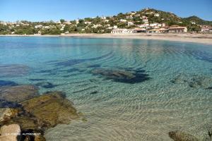 a view of a beach with rocks and the water at Porticcio - Agosta Plage - T2 - Chez Cath et JC in Albitreccia +10 photos