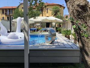 a pool with an inflatable at Infinity Passion in Rho