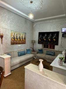 a living room with a couch and a table at Ouzoud le Panorama in Ouzoud +64 photos