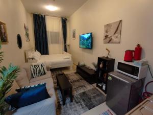 Ένα ή περισσότερα κρεβάτια σε δωμάτιο στο The 1Residence Dubai