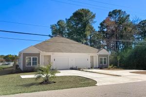 a house with a garage and a driveway at Old Bryan Salento - B in Myrtle Beach