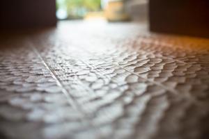 a close up of a tiled floor at 間人温泉 炭平 in Kyotango