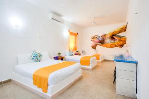 Postel nebo postele na pokoji v ubytování HOTEL LAS COLORADAS