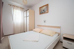 Postel nebo postele na pokoji v ubytování Apartment Vidalici 6519c