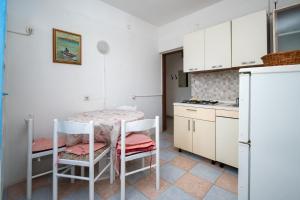 Kuchyň nebo kuchyňský kout v ubytování Apartment Vidalici 6519c