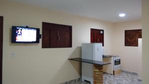TV a/nebo společenská místnost v ubytování Chalé Alto Mar Flats