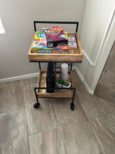 a table with books and magazines on it at Stay in Style Scottsdale 1st Floor Condo in Scottsdale