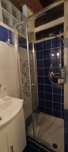 a bathroom with a shower and a sink at L' Atelier Velly in Formello