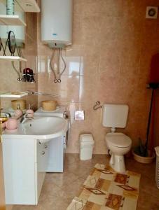 a bathroom with a sink and a toilet at Apartments with parking space Cizici, Krk - 15415 in Malinska +17 photos