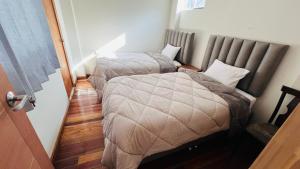 Postelja oz. postelje v sobi nastanitve intikilla hostal