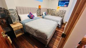 Postelja oz. postelje v sobi nastanitve intikilla hostal
