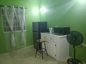 Kuchyň nebo kuchyňský kout v ubytování Maggie's Suites