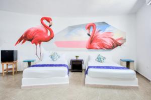 Postel nebo postele na pokoji v ubytování HOTEL LAS COLORADAS