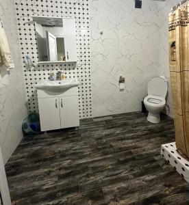 a bathroom with a sink and a toilet at Racha - ABA in Ambrolauri +9 photos