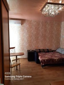 Ένα ή περισσότερα κρεβάτια σε δωμάτιο στο Gold Odessa