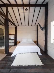Katil atau katil-katil dalam bilik di CABANAS na ROCHA IPÊ ROSA