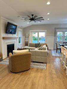 a living room with a couch and a fireplace at The Heart of Ocean City - Walk to beach, shopping and restaurants in Ocean City