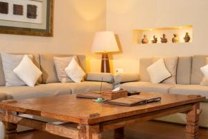a living room with a coffee table and couches at Sienna Villas - CHSE Certified in Seminyak