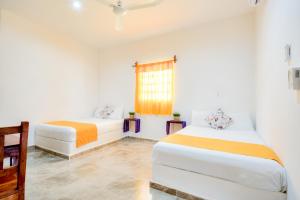 Postel nebo postele na pokoji v ubytování HOTEL LAS COLORADAS