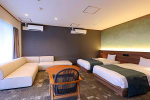 Postel nebo postele na pokoji v ubytování Ooedo Onsen Monogatari Premium Kinugawa Kanko Hotel + 37 fotografií