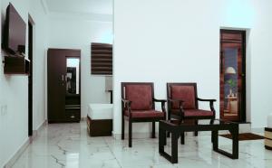 Posezení v ubytování Hotel Gold Suite, Kakkanad