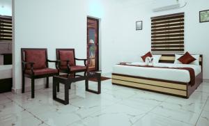 Postel nebo postele na pokoji v ubytování Hotel Gold Suite, Kakkanad
