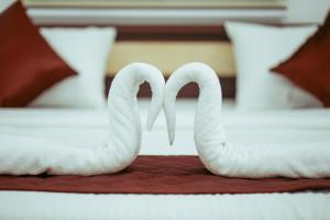 Postel nebo postele na pokoji v ubytování Hotel Gold Suite, Kakkanad