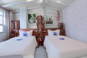 Afbeelding uit fotogalerij van Zhoujia Hostel in Zhangjiajie