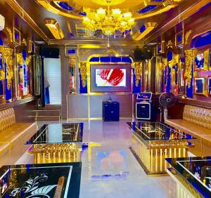 a room with a television and a dance floor at Nobita Villa Venuestay in Hanoi