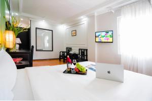 TV a/nebo společenská místnost v ubytování Hanoi Sunshine Hotel