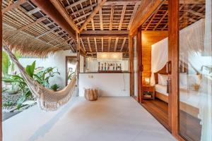 a room with a hammock in a villa at Villa Madah - Secluded & Romantic Retreat 1BR Near Umalas with Private Pool & View in Kerobokan +40 photos