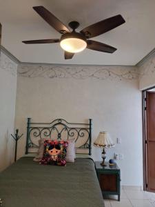 A bed or beds in a room at HOTEL CASA LIMON