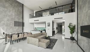 a living room with a couch and a table at Luxcity Hotel & Apartment in Phnom Penh
