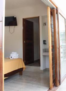 a room with a bed and a basketball hoop on the wall at BM Zihua Casa de Huéspedes in Zihuatanejo