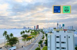 a view of a city with a beach and a building at Sontra Sea Hotel in Danang
