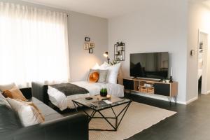 Μια τηλεόραση ή/και κέντρο ψυχαγωγίας στο Industrial Apartment für 8 - Gemeinsam auf Reisen