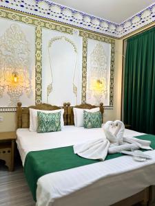 Ένα ή περισσότερα κρεβάτια σε δωμάτιο στο Hotel Zarhal