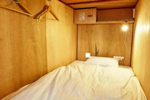 Letto o letti in una camera di WGJ Hostel