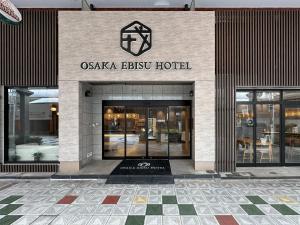 a building with the entrance to a casa elisu hotel at Osaka Ebisu Hotel in Osaka