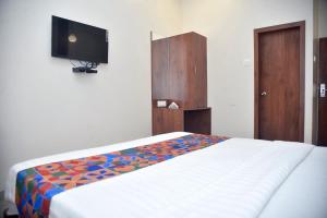 Postel nebo postele na pokoji v ubytování Hotel Pride Inn