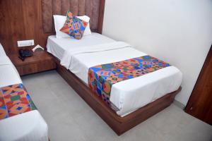 Postel nebo postele na pokoji v ubytování Hotel Pride Inn